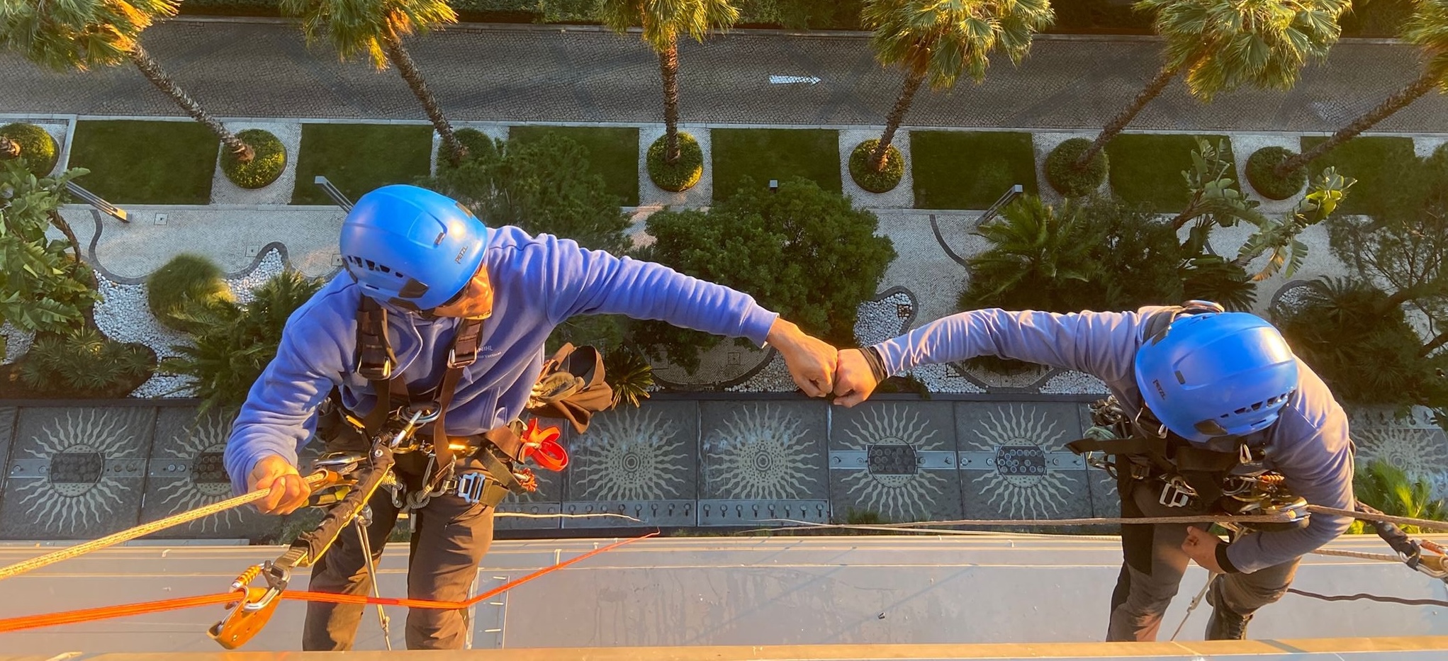 image of two people working